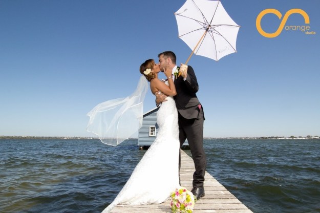 Alex and Shazzy Posing On Their Wedding Day at Matildas on the Swan River, Perth, WA
